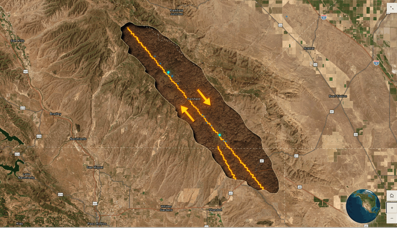 An animation of a cutaway map showing the movement of tectonic plates under the ground; the map is satellite imagery and the cutaway is located on a fault line.