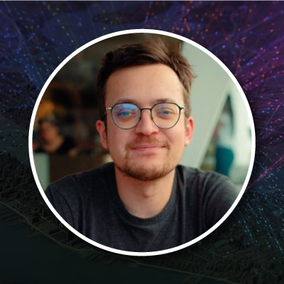 A profile photo of a smiling person wearing round glasses in a circular frame against a colorful cartographic background