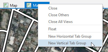 right click on one of the map tabs and choose "New Vertical Tab Group"