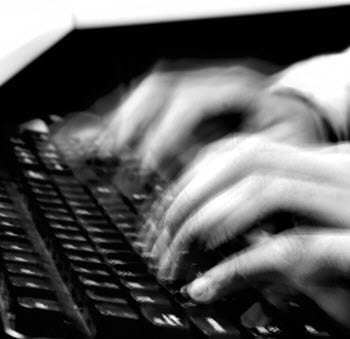 blurred hands typing
