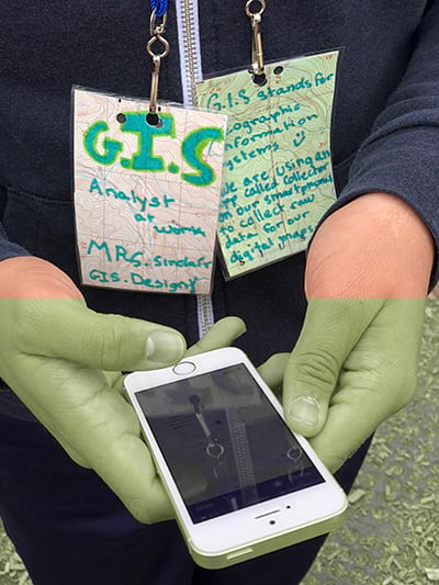 Student collects GIS data with a phone Student collects GIS data with a phone