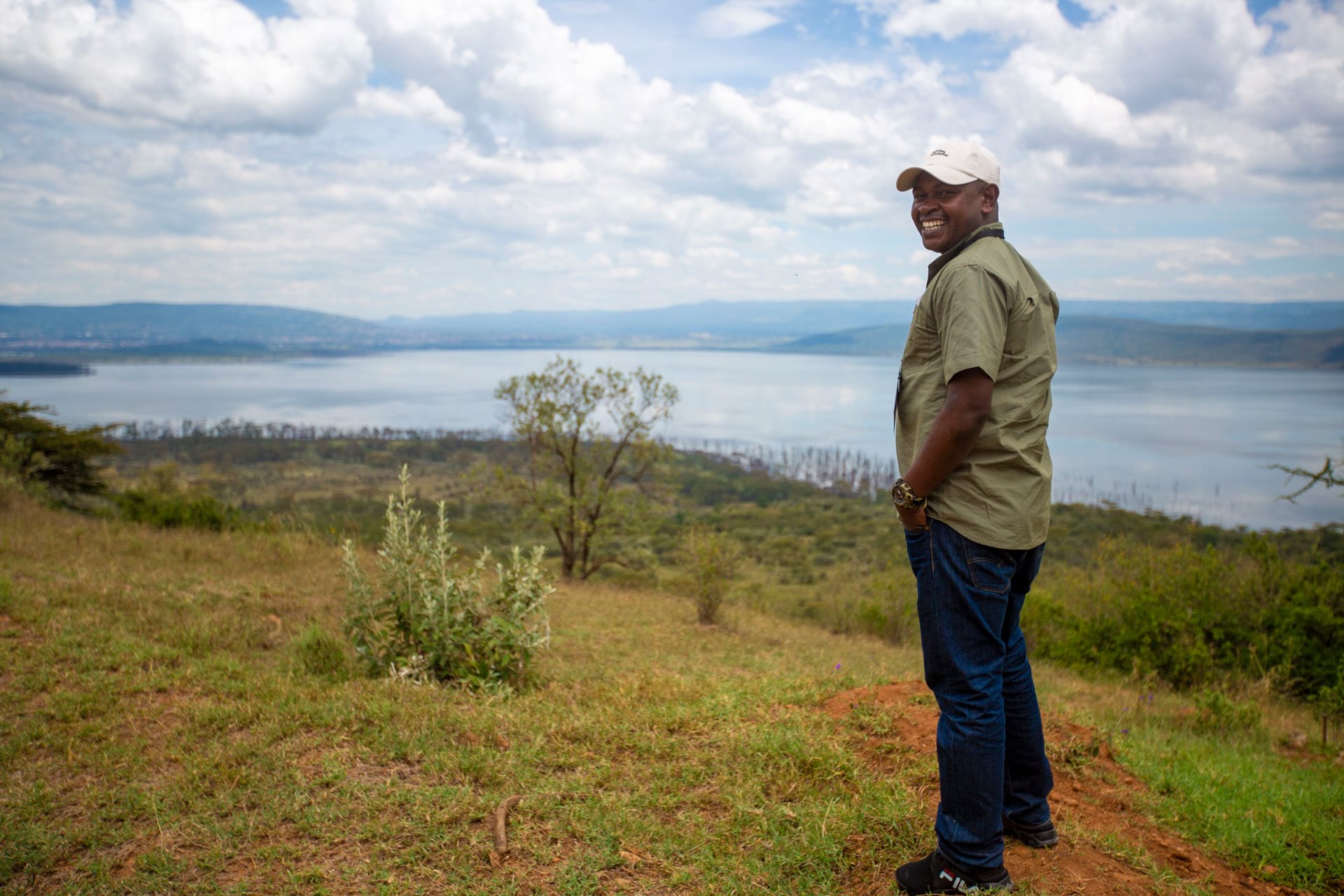 Daniel Mweta from Tanzania National Parks looks out from Out of Africa viewpoint in Lake Nakuru National Park. Photo: Ross Donihue