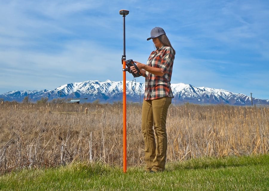 Field worker using Survey123 with a Mesa 2 and Geode GNSS receiver