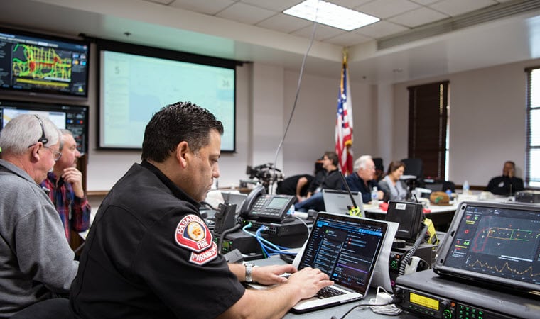 Event staff monitoring the Rose Parade using Esri technology