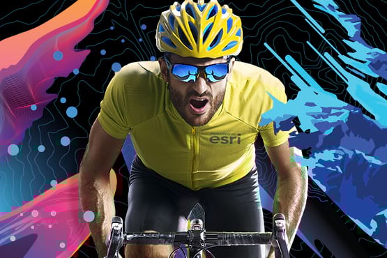 Esri UC Virtual Run/Walk/Bike 2021 cyclist wearing mirrored sunglasses and wearing a yellow jersey riding toward you Esri UC Virtual Run/Walk/Bike 2021 cyclist wearing mirrored sunglasses and wearing a yellow jersey riding toward you