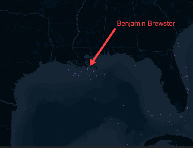 A screenshot of part of a dark blue themed web map of the Gulf Coast of the United States, with ships sunken during World War II visible and one of them, the Benjamin Brewster, annotated with a red arrow