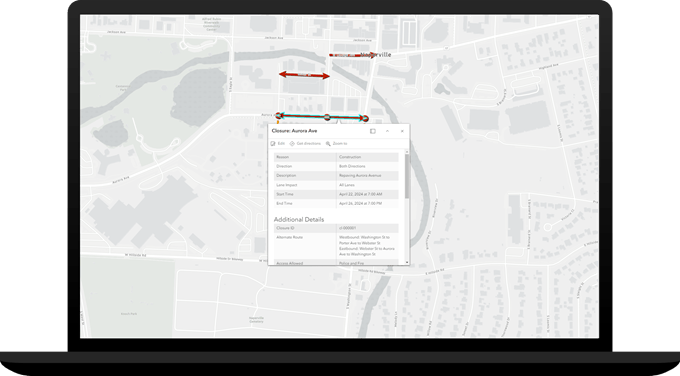 Laptop showing a road closure map with pop-up information about the closure.