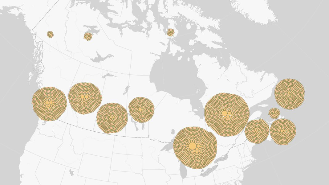 Map of Canada with packed circles centered on each province and territory representing the population of places located within each geography.