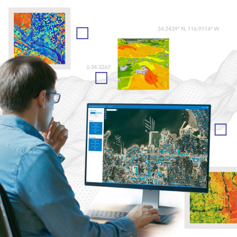 Man in front of computer analyzing a satellite image. Man in front of computer analyzing a satellite image.