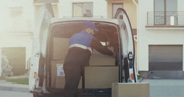 Man unloading package from a delivery truck.