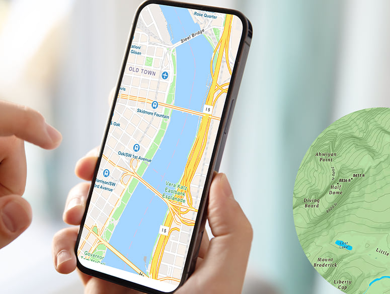 a hand holding a mobile device showing a street map a hand holding a mobile device showing a street map