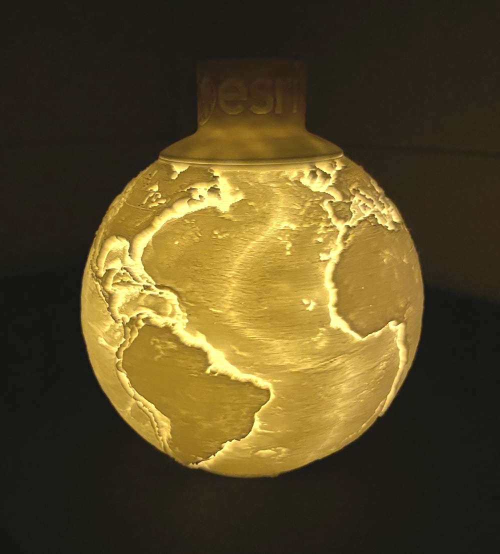 a 3D printed lithophane of earth with light on
