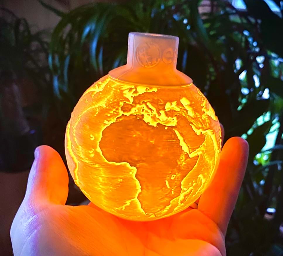 a 3D printed lithophane of Earth's terrain and bathymetry