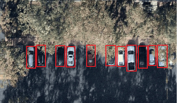 In this example, we label occluded cars by the trees as if they are fully visible.
