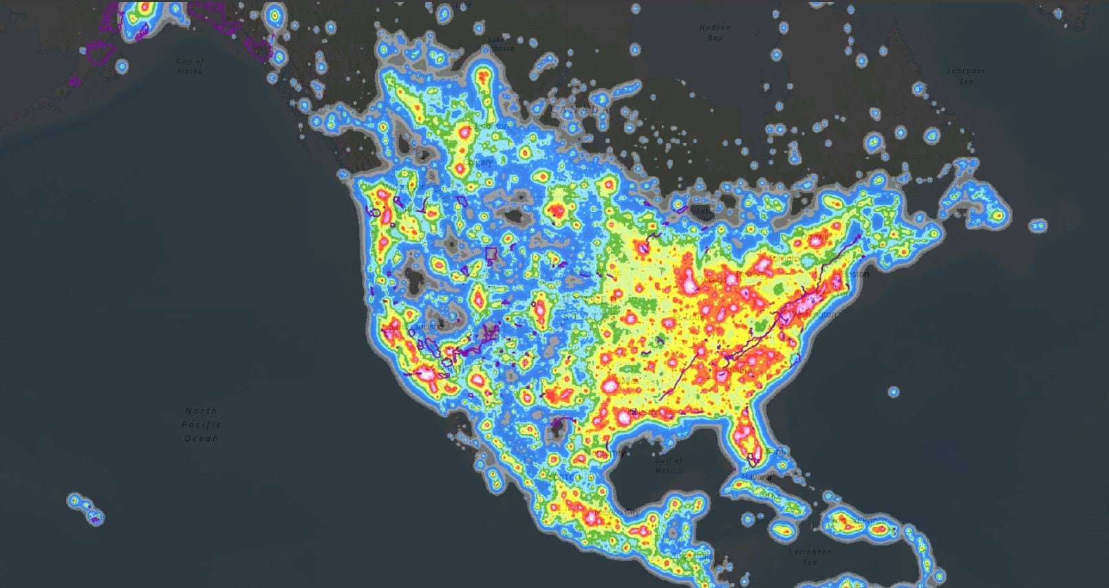 A map of 2023 All-sky Light pollution Ration model of North America with NPS units overlaid in purple