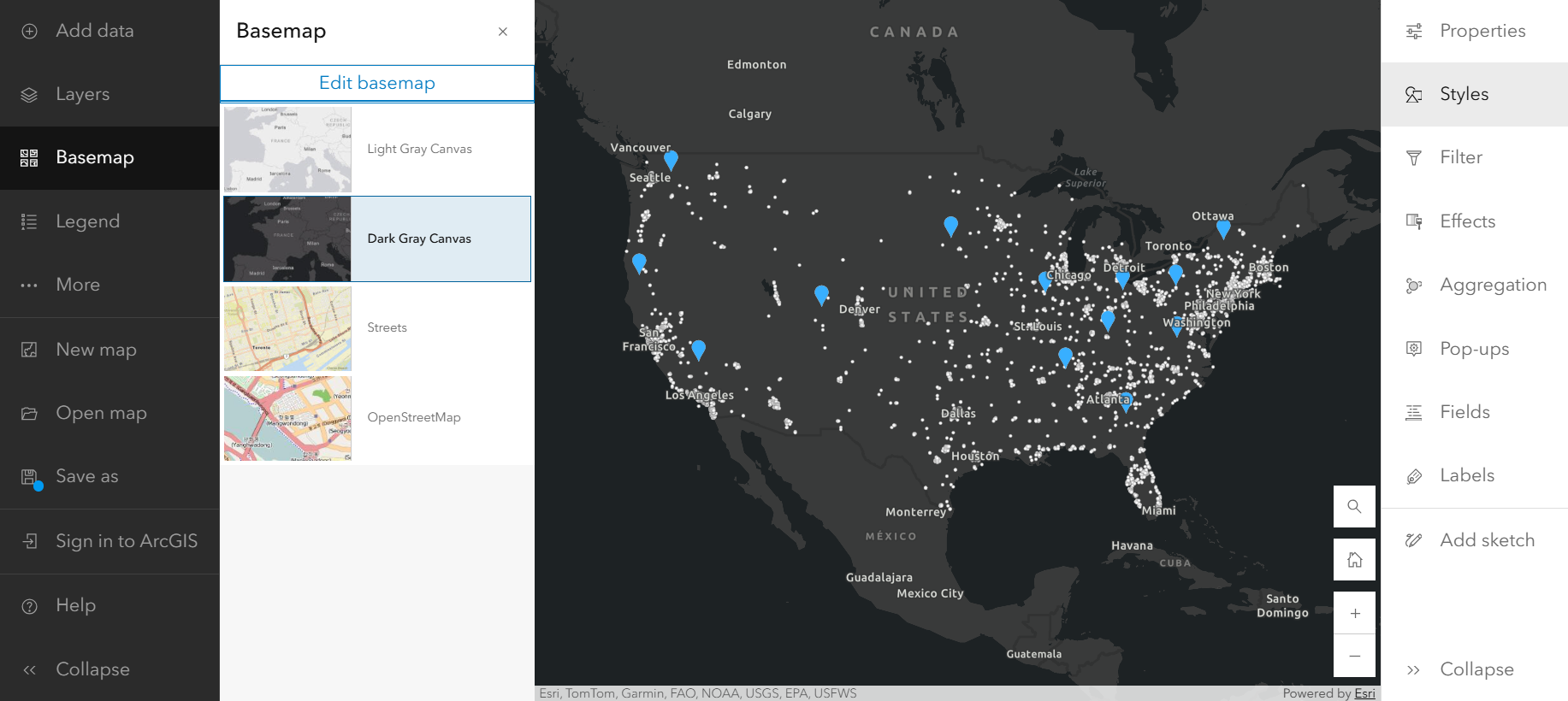 Dark grey map of the United States with blue pins