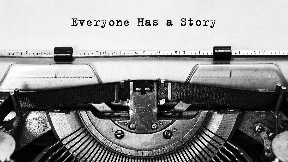 A sheet in a typewriter that says everyone has a story