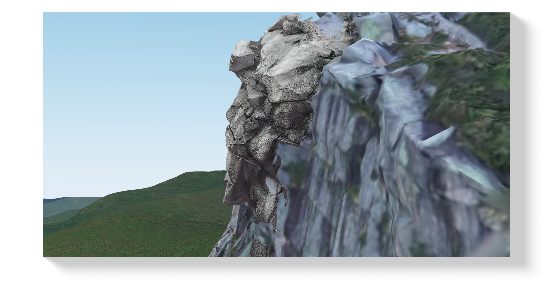 Landscape photo of a mountain in New Hampshire featuring a rock formation known as 'The Old Man of the Mountain,' which resembles a human face in profile. The scene includes green hills and a clear blue sky.