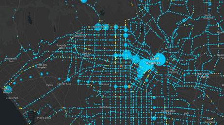 A concentration map of a city with bright blue points on a dark gray background