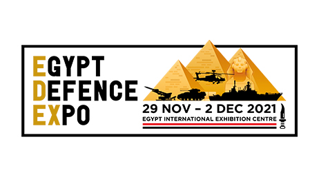 A logo for the Egypt Defence Expo that includes of a design of military vehicles silhouetted in front of pyramids