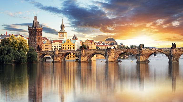 City skyline of Prague with a bridge in the foreground