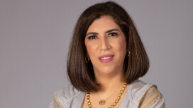 Portrait of Nadine Sherif with a pearl gray background