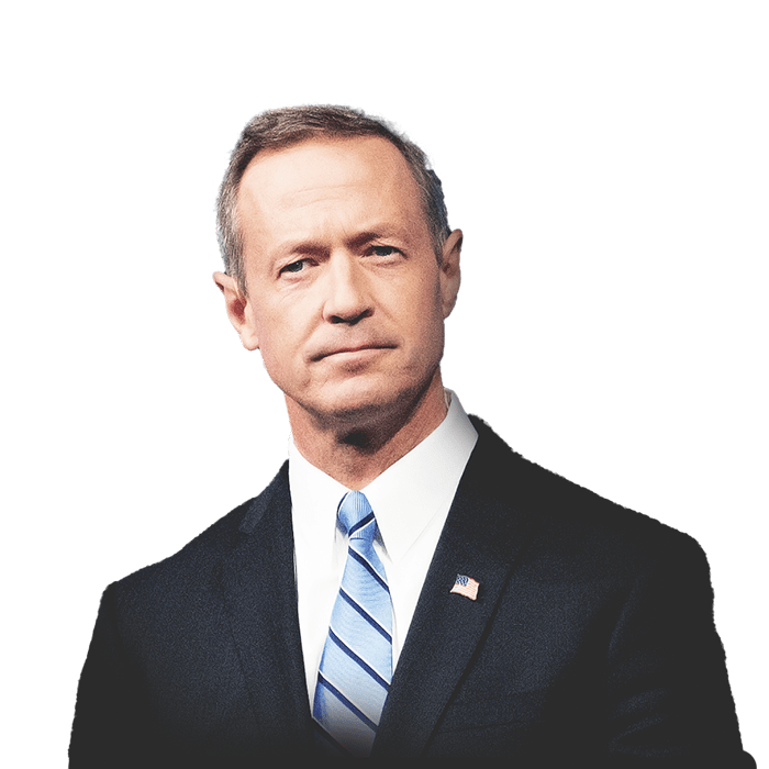 Martin O’Malley, governor of Maryland, wearing a suit and tie with an American flag pin on his lapel, and a beach pier in the background