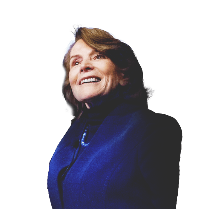 Sylvia Earle, marine biologist, and a background of a crashing wave