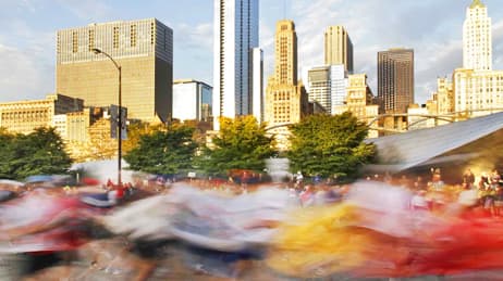 Chicago city skyline with runners passing in a blur