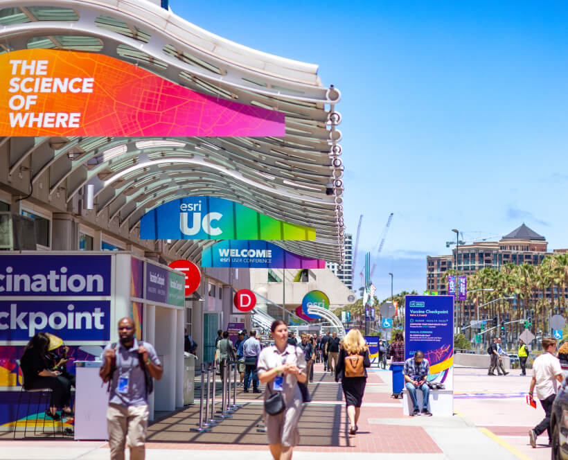 A walkway in front of the San Diego Convention Center hung with Esri UC signage