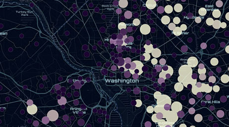 A map of Washington in the ArcGIS Living Atlas of the World showing community impact on the environment using purple and tan-colored circles