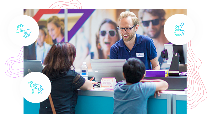 Two children at an event information booth interacting with the attendant