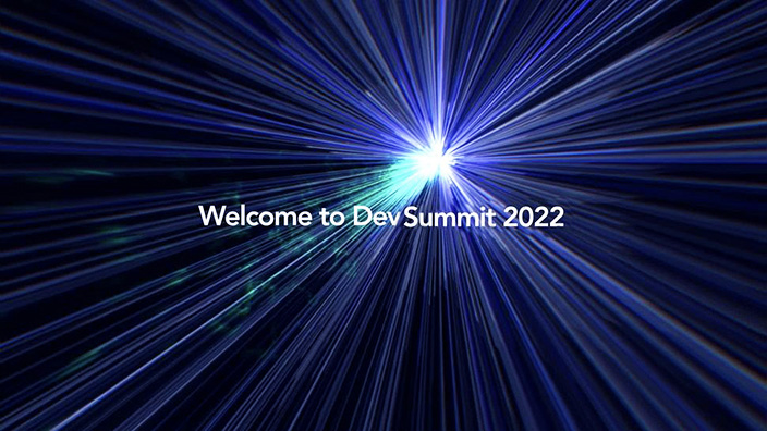 Starburst effect on a dark blue background with the title in white, Welcome to DevSummit 2022