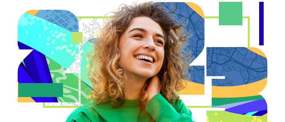 Smiling person in a green top against a background of map elements contained in the numbers 2023