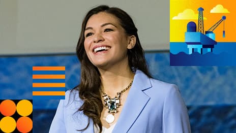 A smiling presenter wearing a light blue blazer overlaid with a colorful graphic of an oil refinery