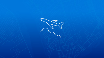 A simple line icon of the side view of an airplane over clouds in white lines on a blue background