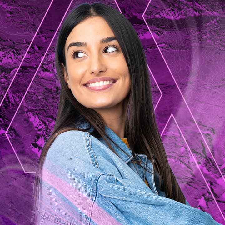 Smiling guest looking over their right shoulder wearing a denim jacket in front of a purple background with mapping graphics