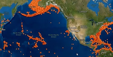Map of the North Pacific Ocean with orange data points along continental coastlines and scattered throughout the ocean