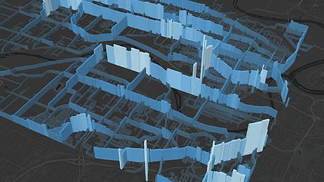 3D map with blue elevations of various heights marking traffic routes against a black background