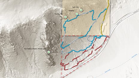 Terrain map with extruded dimensional area showing red and blue routes