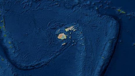 Dark blue swirls with the Fiji Islands in the center