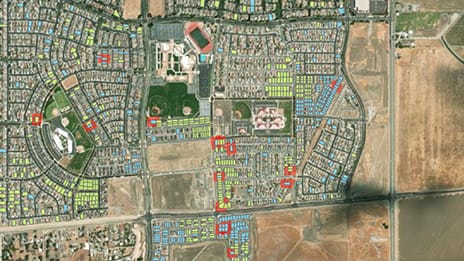 Map of a residential housing development bordered by open land, seen from above