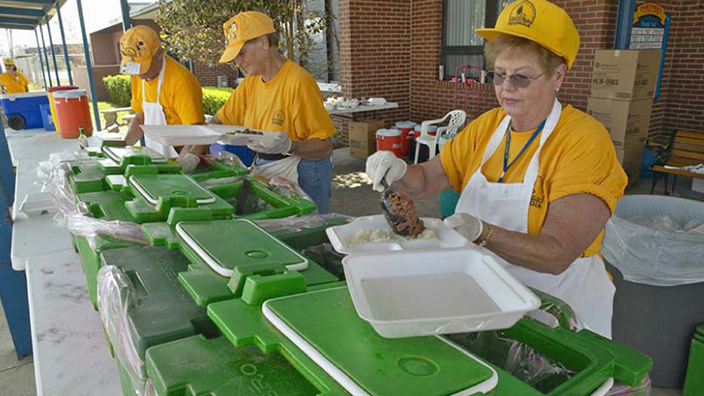 Aid workers serving food