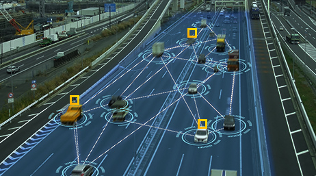 A digital rendering of cars on a highway with a blue graphic overlay on the road and white circles around vehicles connected by white lines