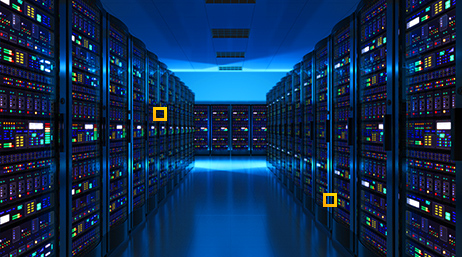 A computer server room with dim blue lighting