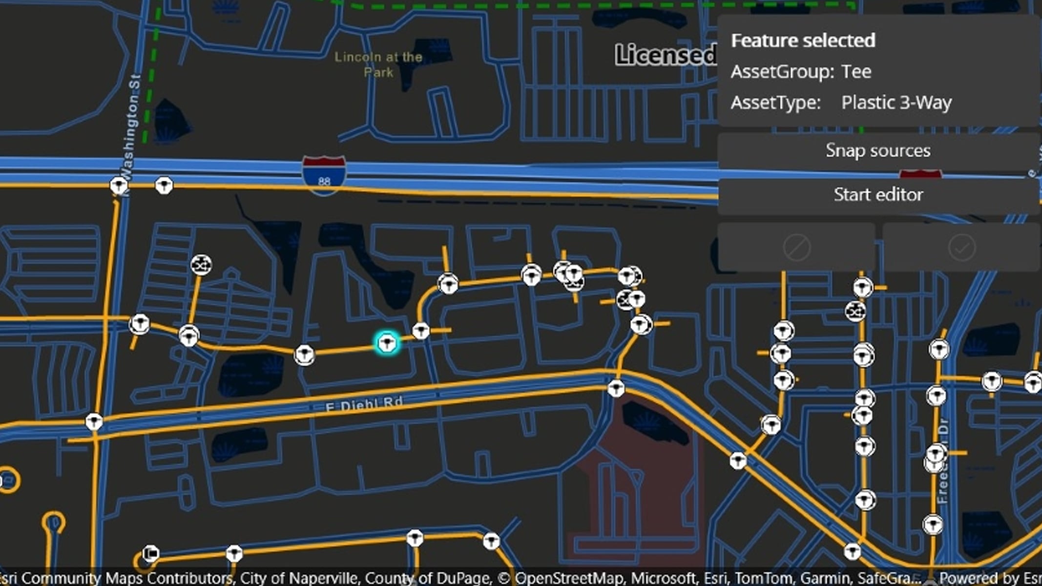 Simple dark blue map depicting streets with yellow points indicating utility connections 