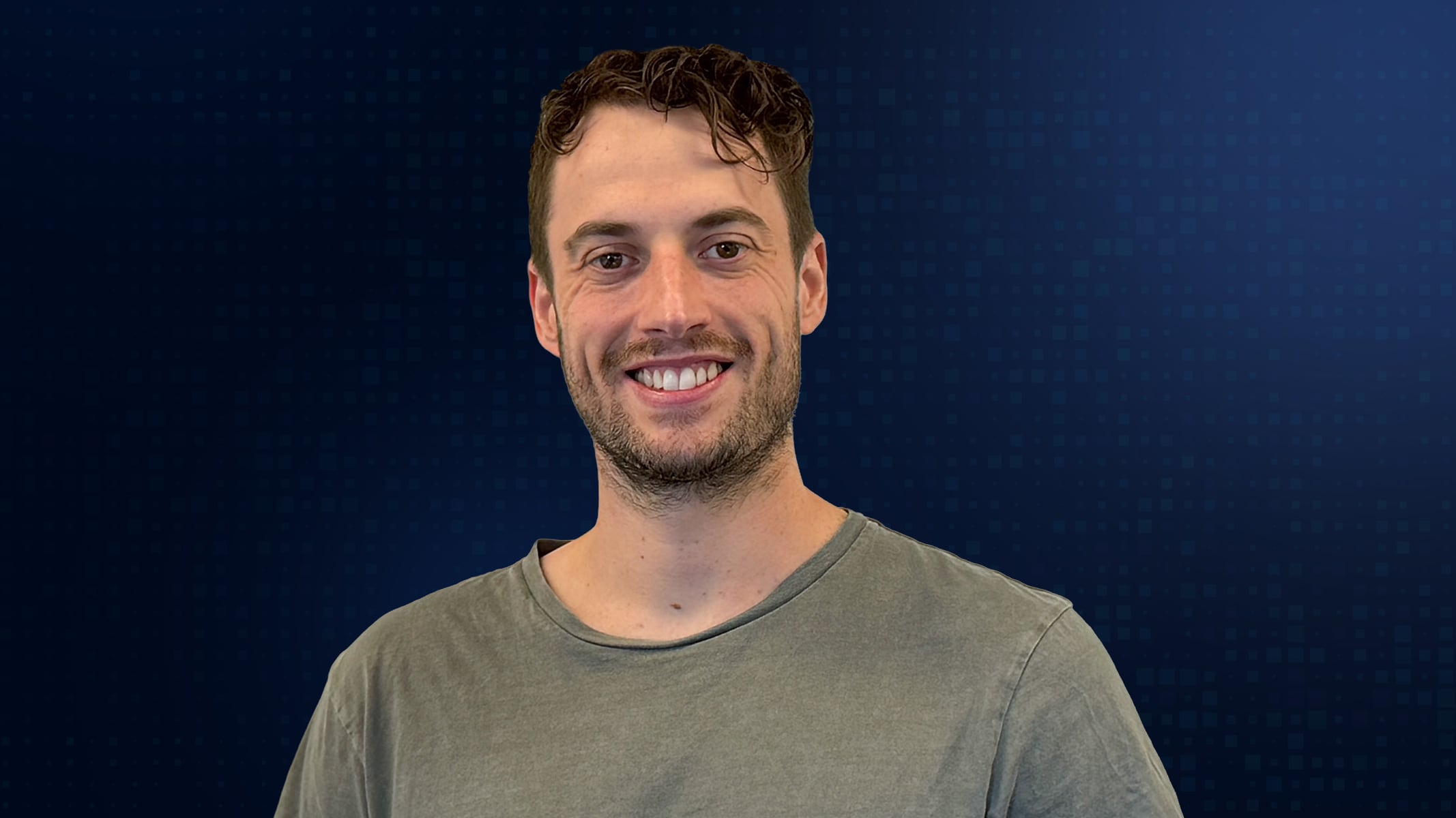 Portrait of Ben Matthys smiling in a gray tee shirt