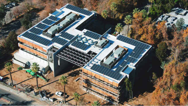 An aerial view of Esri’s Redlands campus buildings with solar panels covering the rooftops