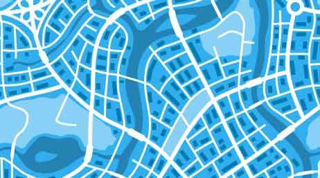 A blue map of roads and waterways winding through a city