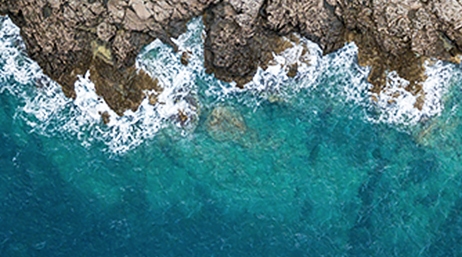An aerial view of a rocky coast and the ocean
